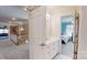 Upstairs bathroom featuring a single sink with white cabinets and hallway view at 101 Saddletree Rd, Lincolnton, NC 28092