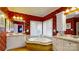 Elegant bathroom with a corner tub, double vanities, and red decorative wallpaper at 101 Saddletree Rd, Lincolnton, NC 28092