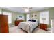 Bright bedroom featuring neutral carpet, olive green walls, and natural light from two windows at 101 Saddletree Rd, Lincolnton, NC 28092