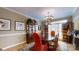 Formal dining room with a large wooden table, chandelier, and beautiful artwork at 101 Saddletree Rd, Lincolnton, NC 28092