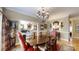 Bright dining area with beautiful chandelier, seating for six and hardwood floors at 101 Saddletree Rd, Lincolnton, NC 28092