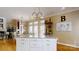 Island seating with pendant lights, and ample prep space in this chef's kitchen at 101 Saddletree Rd, Lincolnton, NC 28092