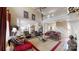Open concept living area with soaring ceilings, staircase, and a view into the kitchen at 101 Saddletree Rd, Lincolnton, NC 28092