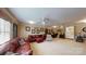 Spacious carpeted living room featuring multiple ceiling fans and two sofas at 101 Saddletree Rd, Lincolnton, NC 28092