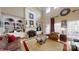 Spacious living room with high ceilings, large windows, a fireplace, and built-in shelving units at 101 Saddletree Rd, Lincolnton, NC 28092