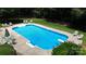 Backyard in-ground swimming pool with diving board, chairs and fenced-in yard at 101 Saddletree Rd, Lincolnton, NC 28092