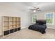 Well-lit bedroom with a ceiling fan, cube storage unit, and natural light from two windows at 1027 Williamston Dr, Marshville, NC 28103