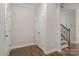 Clean and bright entryway with wood floors and a staircase leading upstairs at 1027 Williamston Dr, Marshville, NC 28103