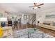 Open concept living room with wood floors flows into a dining area and kitchen at 1027 Williamston Dr, Marshville, NC 28103