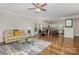 Open concept living room flows into a dining area and modern kitchen with an island at 1027 Williamston Dr, Marshville, NC 28103