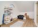 Spacious attic storage area with wood floors and a variety of storage containers at 1029 Seminole Dr, Waxhaw, NC 28173