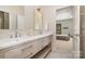 Bathroom boasts double sinks, a sleek vanity, and a view to the adjacent bedroom at 1029 Seminole Dr, Waxhaw, NC 28173