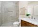 Bathroom featuring a glass shower, granite counters, and wood cabinets at 1029 Seminole Dr, Waxhaw, NC 28173
