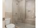 Modern bathroom with a glass enclosed shower, tiled walls, and built in shower seat at 1029 Seminole Dr, Waxhaw, NC 28173