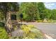 Stone entrance to the Country Club of the Carolinas at Treethorne surrounded by colorful landscaping at 1029 Seminole Dr, Waxhaw, NC 28173