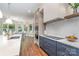 Spacious kitchen featuring a large island, stainless steel appliances and hardwood floors at 1029 Seminole Dr, Waxhaw, NC 28173