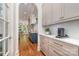 Bright, open kitchen with custom cabinetry, quartz countertops, and stainless steel appliances at 1029 Seminole Dr, Waxhaw, NC 28173