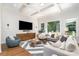 Bright living room featuring hardwood floors, coffered ceiling and large windows at 1029 Seminole Dr, Waxhaw, NC 28173