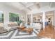 Spacious living room with hardwood floors, coffered ceiling, and open kitchen concept at 1029 Seminole Dr, Waxhaw, NC 28173