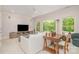 Open living room with large windows offering lots of natural light, a ceiling fan, and comfortable seating at 1029 Seminole Dr, Waxhaw, NC 28173