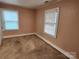 Bedroom with neutral carpet and two windows providing natural light at 109 Starnes St, Chester, SC 29706