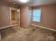 Bedroom with carpet, a closet and access to another room at 109 Starnes St, Chester, SC 29706