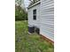 Exterior view of the home featuring the HVAC system and vinyl siding at 109 Starnes St, Chester, SC 29706
