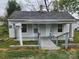 Modest single story home featuring a small front porch, gray siding, and a quaint mailbox at 109 Starnes St, Chester, SC 29706