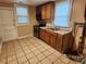 Kitchen features tile floor, cabinets, stainless steel appliances and window at 109 Starnes St, Chester, SC 29706