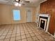 Living room featuring a decorative fireplace and tile flooring at 109 Starnes St, Chester, SC 29706