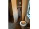 Bathroom with an exposed pipe and toilet with a window letting in natural light at 1336 Mt Sinai Church Rd, Shelby, NC 28152