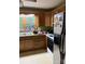Traditional kitchen featuring oak cabinets, black appliances and a double bowl sink at 1336 Mt Sinai Church Rd, Shelby, NC 28152