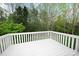 White fenced deck area offers a great outdoor space to enjoy the view of surrounding greenery at 1353 33Rd Avenue Ne Dr, Hickory, NC 28601