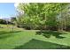 Well-maintained lawn provides a serene backdrop, complemented by mature trees at 1353 33Rd Avenue Ne Dr, Hickory, NC 28601