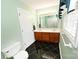 Spacious bathroom with a double sink vanity, large mirror, and black tiled flooring at 1353 33Rd Avenue Ne Dr, Hickory, NC 28601