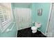 Bathroom with a toilet, vanity, framed mirror and shower with curtain at 1353 33Rd Avenue Ne Dr, Hickory, NC 28601