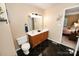 Well-lit bathroom features dual sinks, black tile floor, and vanity at 1353 33Rd Avenue Ne Dr, Hickory, NC 28601