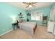 A cozy bedroom features carpeted floors, a ceiling fan, and a window for natural light at 1353 33Rd Avenue Ne Dr, Hickory, NC 28601