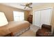 Cozy bedroom with a ceiling fan, natural light, and ample closet space at 1353 33Rd Avenue Ne Dr, Hickory, NC 28601