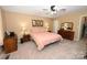 Comfortable bedroom with carpet and ceiling fan, dresser, and lamps at 1353 33Rd Avenue Ne Dr, Hickory, NC 28601