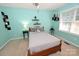 Comfortable bedroom with a cozy bed, two side tables and floating shelves for stylish storage at 1353 33Rd Avenue Ne Dr, Hickory, NC 28601
