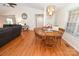 Dining area featuring a wooden table with seating for four, next to a living room at 1353 33Rd Avenue Ne Dr, Hickory, NC 28601