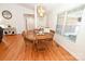 Eat-in dining room features hardwood floors, chandelier, and large window at 1353 33Rd Avenue Ne Dr, Hickory, NC 28601