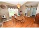 Traditional dining room with wood table, chandelier, and beautiful hardwood floors at 1353 33Rd Avenue Ne Dr, Hickory, NC 28601
