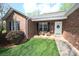 Cozy front porch with chairs offers a warm welcome to this brick home at 1353 33Rd Avenue Ne Dr, Hickory, NC 28601