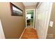 Hallway with hardwood floors leading to a bedroom at 1353 33Rd Avenue Ne Dr, Hickory, NC 28601