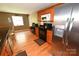 Kitchen featuring stainless steel appliances, wood cabinets, and hardwood floors at 1353 33Rd Avenue Ne Dr, Hickory, NC 28601