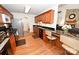 Charming kitchen with an eat-in bar, black dishwasher, sink, and hardwood floors leading to the living room at 1353 33Rd Avenue Ne Dr, Hickory, NC 28601