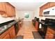 Bright kitchen with stainless appliances, wood cabinets, granite countertops, and breakfast bar at 1353 33Rd Avenue Ne Dr, Hickory, NC 28601