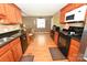 Well-equipped kitchen with wood cabinets, modern appliances, and hardwood floors at 1353 33Rd Avenue Ne Dr, Hickory, NC 28601